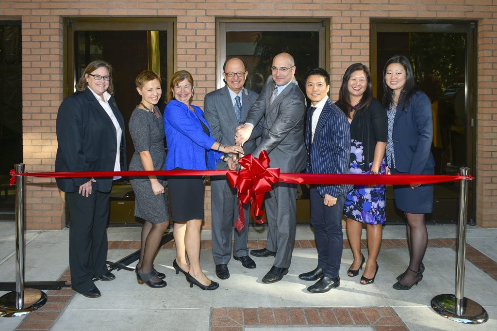 From left to right: associate academic director Valerie Pierce, managing director Aga Paul, academic director Deborah Detzel, USC President C. L. Max Nikias, vice president for strategic and global initiatives Anthony Bailey, marketing director Terrence Liu, assistant director of administration Pamela Yamamoto Ireland and admissions and advising manager JJ Lee take part in the rededication of the Davidson Conference Center as the new home of the USC International Academy on October 21, 2015. (USC Photo/Gus Ruelas)