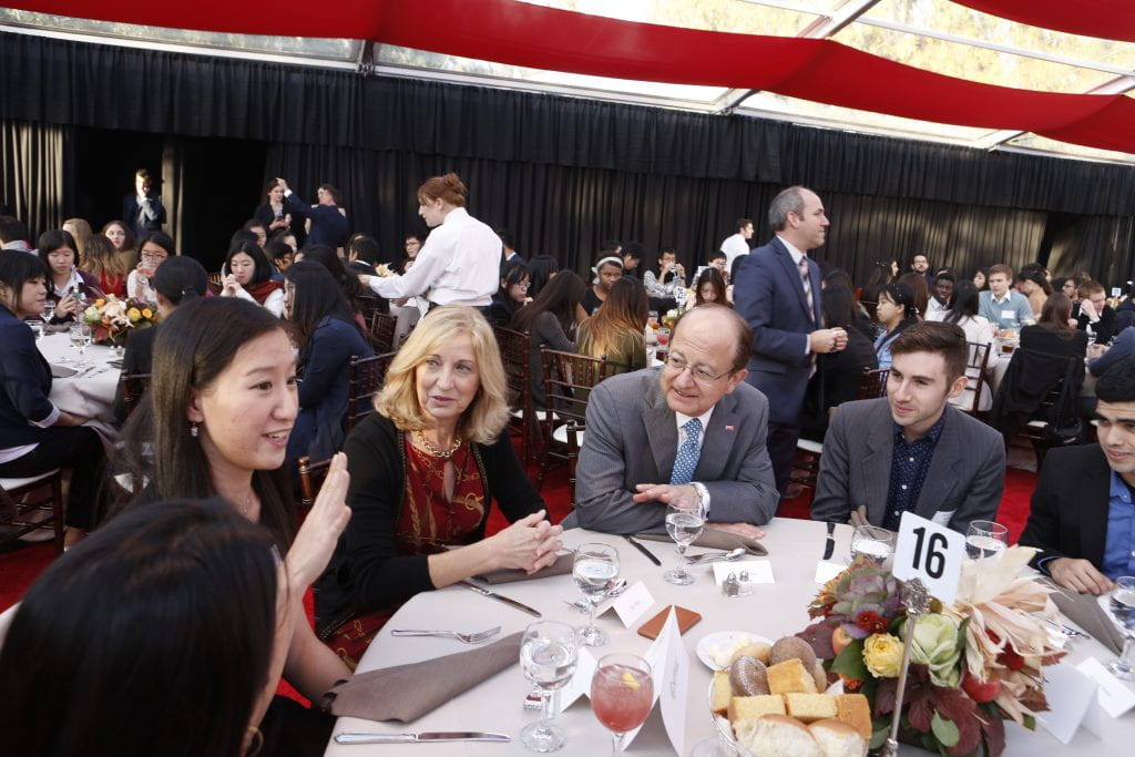 President C. L. Max Nikias and his wife, Niki C. Nikias, enjoy Thanksgiving dinner with students. (Photo: USC/Steve Cohn)