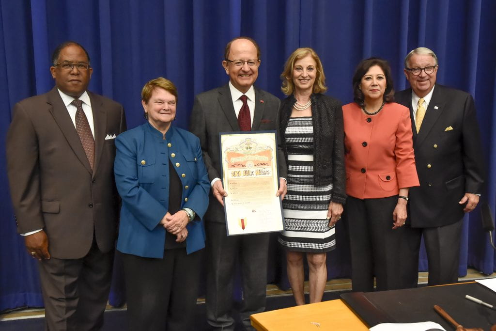 USC President C. L. Max Nikias and First Lady Niki C. Nikias accept a ‘5-Signature Scroll' in recognition of USC’s contributions to the county. With Dr. and Mrs. Nikias are (L-R): Supervisors Mark Ridley-Thomas, Sheila Kuehl, Hilda Solis, and Don Knabe. (USC Photo/Gus Ruelas)